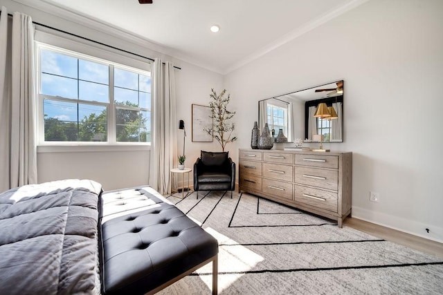 bedroom featuring crown molding, recessed lighting, baseboards, and light wood-style floors