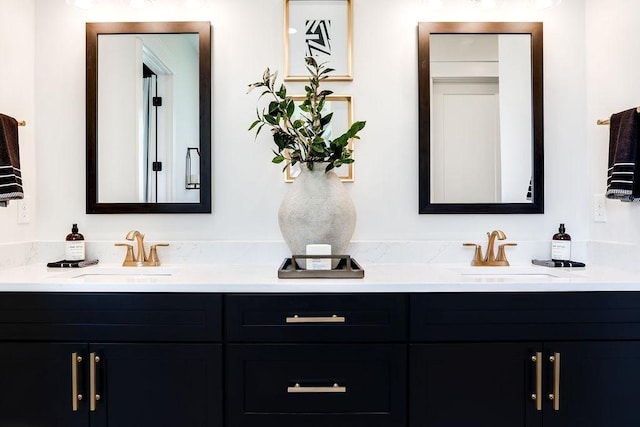 bathroom with double vanity and a sink