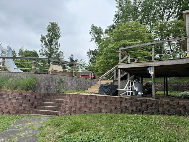 view of yard with stairway and a wooden deck