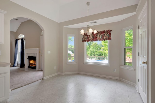 1528 Anthony Way, Mount Juliet, TN 37122 - unfurnished dining area featuring light tile patterned floors, arched walkways, a high end fireplace, baseboards, and a chandelier