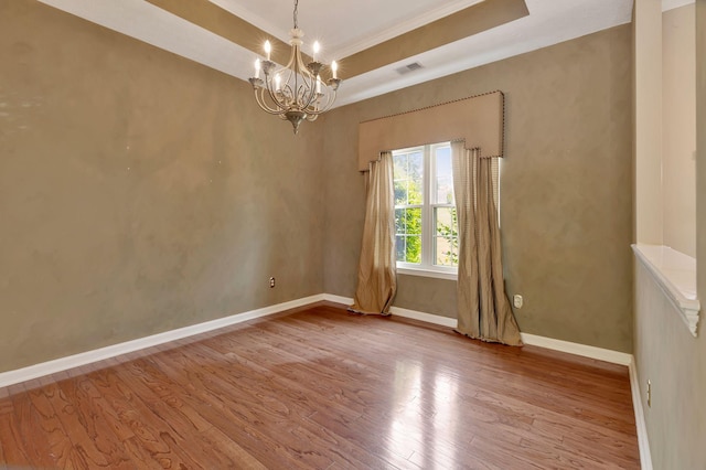 1528 Anthony Way, Mount Juliet, TN 37122 - empty room featuring a chandelier, crown molding, wood finished floors, baseboards, and a tray ceiling