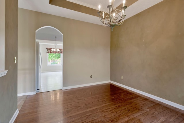 1528 Anthony Way, Mount Juliet, TN 37122 - empty room featuring a chandelier, wood finished floors, arched walkways, and baseboards