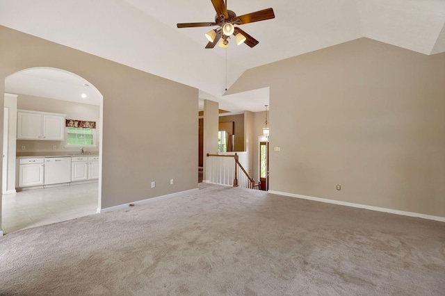 1528 Anthony Way, Mount Juliet, TN 37122 - unfurnished living room with light colored carpet, ceiling fan, vaulted ceiling, baseboards, and arched walkways