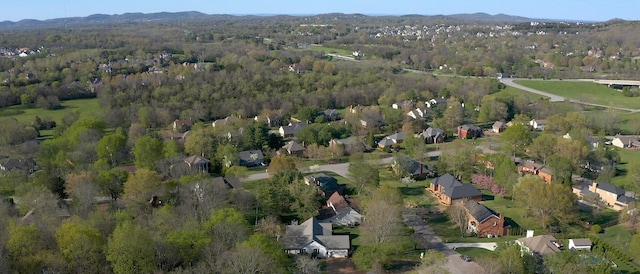 bird's eye view featuring a wooded view and a mountain view