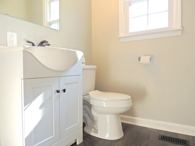 436 Bluff Dr, Clarksville, TN 37043 - half bath with vanity, baseboards, toilet, visible vents, and wood finished floors