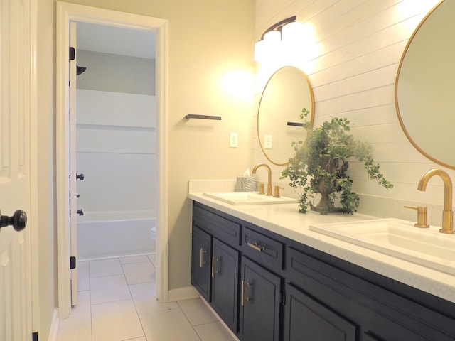 436 Bluff Dr, Clarksville, TN 37043 - full bathroom with wood walls, tile patterned flooring, double vanity, and a sink