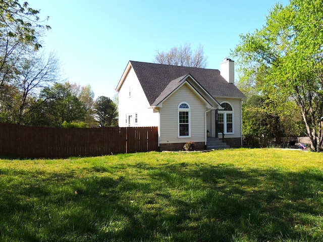 436 Bluff Dr, Clarksville, TN 37043 - exterior space with a front yard, roof with shingles, fence, and a chimney