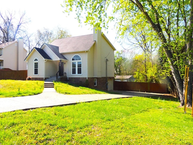 436 Bluff Dr, Clarksville, TN 37043 - view of front of property with a chimney, fence, and a front lawn