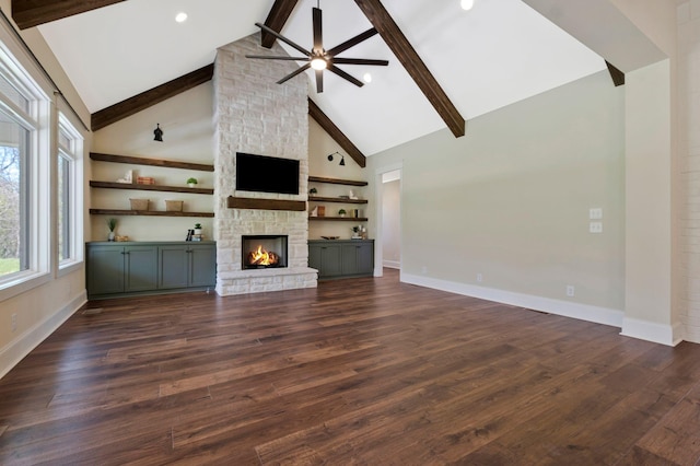 3050 Horn Springs Rd, Lebanon, TN 37087 - unfurnished living room with baseboards, ceiling fan, a fireplace, beamed ceiling, and high vaulted ceiling