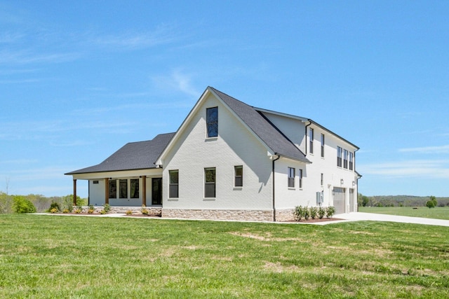 3050 Horn Springs Rd, Lebanon, TN 37087 - modern inspired farmhouse featuring an attached garage, driveway, a front lawn, and brick siding