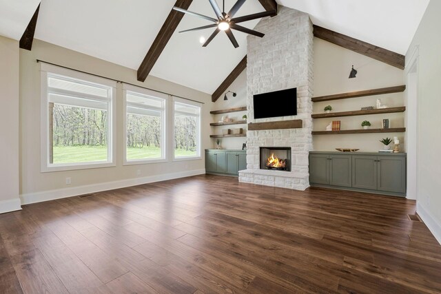 3050 Horn Springs Rd, Lebanon, TN 37087 - unfurnished living room with dark wood-type flooring, beamed ceiling, baseboards, and a stone fireplace