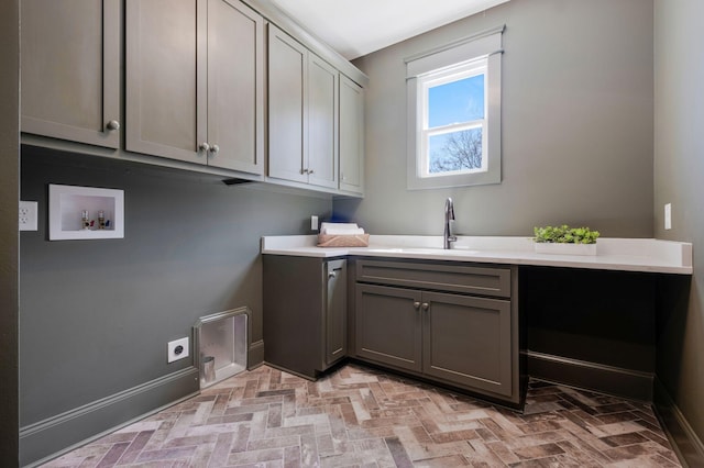 3050 Horn Springs Rd, Lebanon, TN 37087 - clothes washing area featuring cabinet space, brick floor, hookup for a washing machine, and a sink