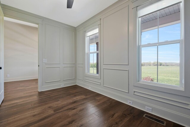 3050 Horn Springs Rd, Lebanon, TN 37087 - spare room with a decorative wall, visible vents, plenty of natural light, and dark wood-type flooring