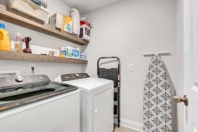 washroom with independent washer and dryer, laundry area, and baseboards
