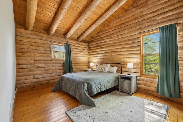 bedroom featuring wood-type flooring, rustic walls, lofted ceiling with beams, and wood ceiling