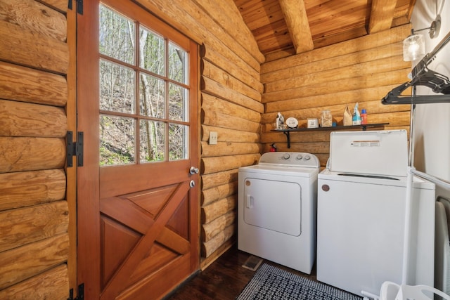washroom featuring plenty of natural light, separate washer and dryer, rustic walls, laundry area, and wood ceiling