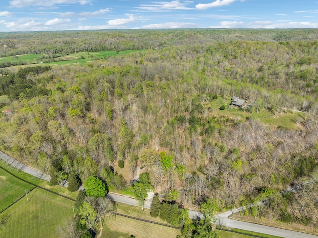 bird's eye view featuring a wooded view