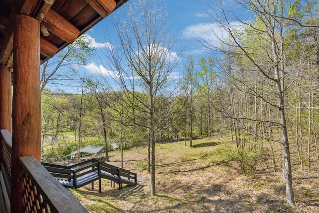 view of yard with a view of trees