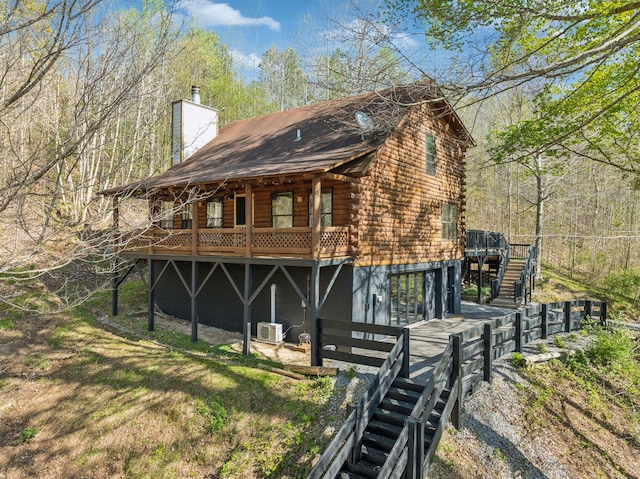 5290 Old Harding Rd, Franklin, TN 37064 - view of front facade with stairs, a wooden deck, log siding, and a chimney