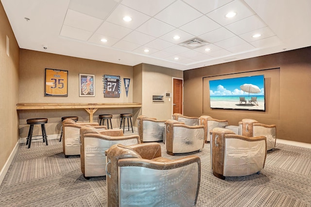 carpeted home theater with recessed lighting, visible vents, baseboards, and a drop ceiling