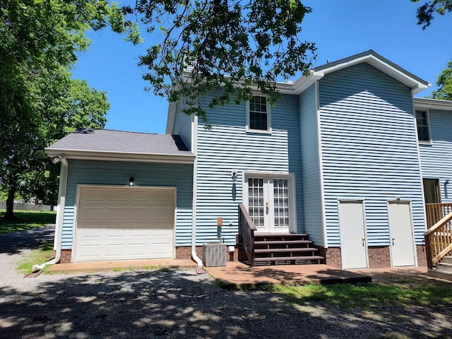 104B Twin Oaks Ct, Hendersonville, TN 37075 - rear view of house featuring french doors, an attached garage, and entry steps