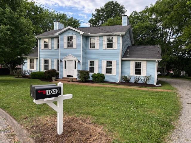 104B Twin Oaks Ct, Hendersonville, TN 37075 - colonial house with a chimney and a front yard