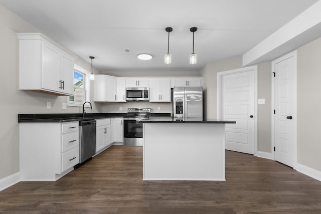 50 Gratton Ests, Clarksville, TN 37043 - kitchen featuring appliances with stainless steel finishes, dark countertops, baseboards, and white cabinets