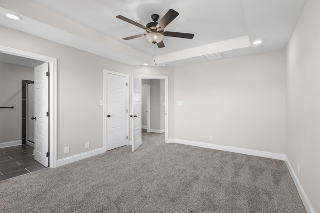 50 Gratton Ests, Clarksville, TN 37043 - unfurnished bedroom with recessed lighting, a raised ceiling, dark carpet, baseboards, and connected bathroom