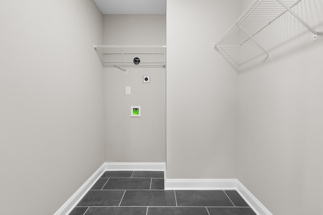 50 Gratton Ests, Clarksville, TN 37043 - laundry area featuring hookup for an electric dryer, dark tile patterned floors, baseboards, and washer hookup