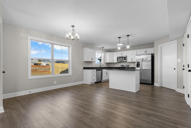 50 Gratton Ests, Clarksville, TN 37043 - kitchen featuring stainless steel appliances, dark countertops, a chandelier, white cabinets, and baseboards