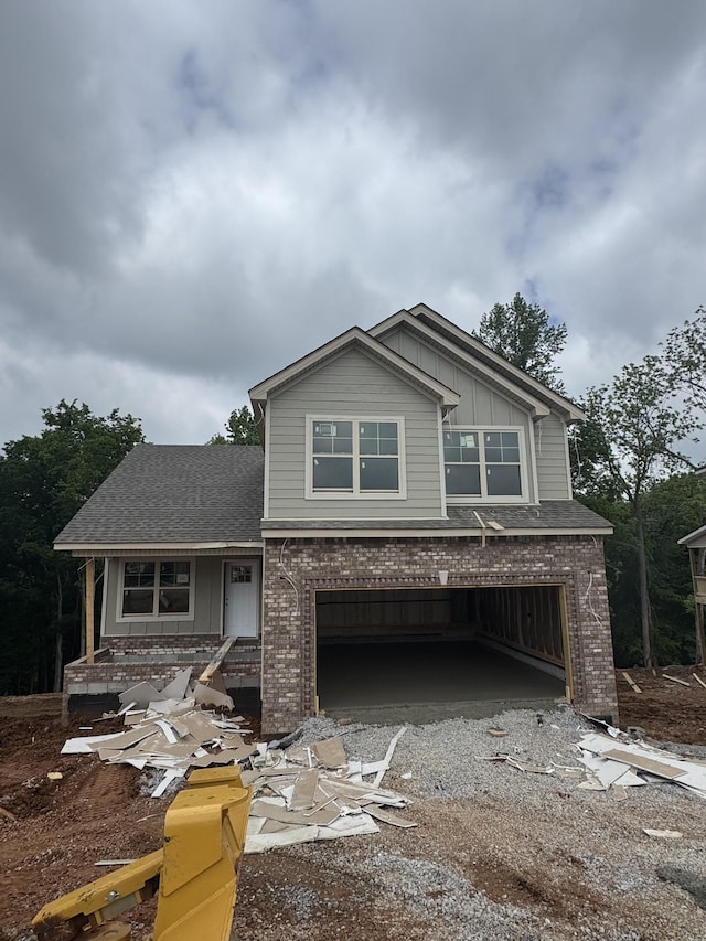 50 Gratton Ests, Clarksville, TN 37043 - view of front of house with brick siding, a garage, board and batten siding, driveway, and a shingled roof