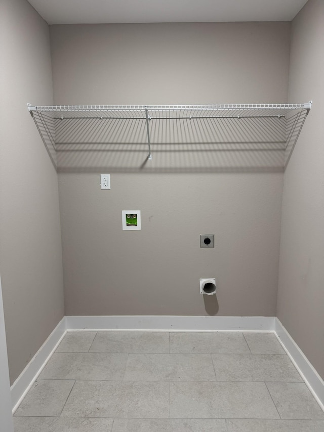 170 Cardinal Crk, Clarksville, TN 37040 - laundry room featuring electric dryer hookup, baseboards, washer hookup, and light tile patterned floors