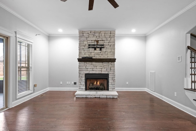 unfurnished living room with crown molding, a ceiling fan, dark wood finished floors, and visible vents