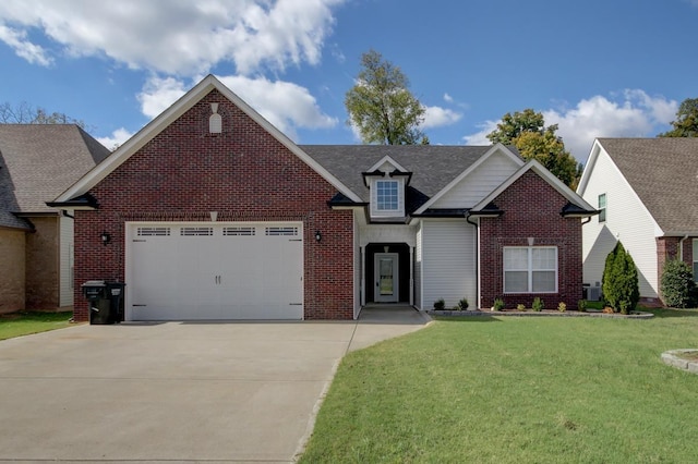 traditional-style house with brick siding, a front lawn, an attached garage, and driveway