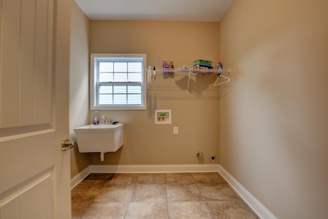 2256 Ellington Gait Dr, Clarksville, TN 37043 - laundry room featuring hookup for a washing machine and baseboards