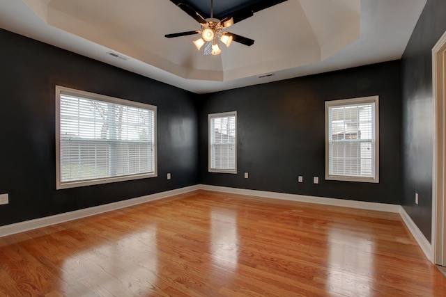 2256 Ellington Gait Dr, Clarksville, TN 37043 - empty room featuring a raised ceiling, light wood-style flooring, and a ceiling fan