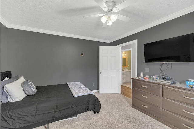 bedroom featuring light carpet, baseboards, ornamental molding, and a textured ceiling