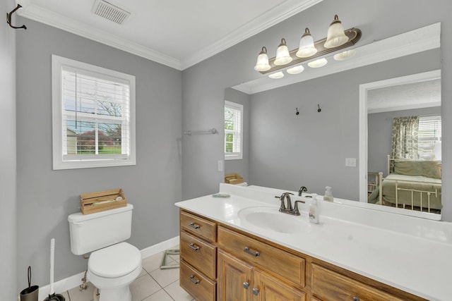 bathroom featuring visible vents, baseboards, toilet, crown molding, and tile patterned floors