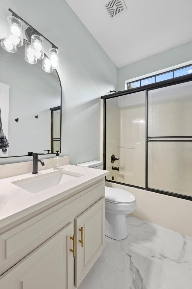 9401 Lazy Circles Dr, Ooltewah, TN 37363 - full bath with vanity, toilet, bath / shower combo with glass door, and marble look tile flooring