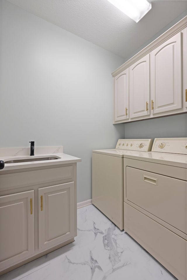 9401 Lazy Circles Dr, Ooltewah, TN 37363 - washroom featuring washing machine and clothes dryer, cabinet space, and light marble finish floors