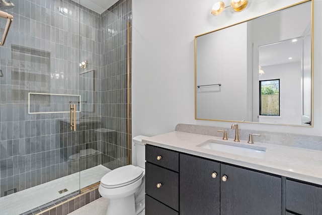 full bath with a shower stall, toilet, and vanity