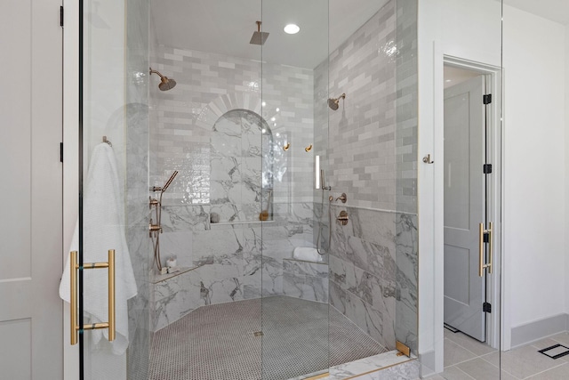 bathroom with recessed lighting, a shower stall, and tile patterned floors
