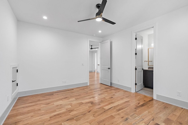 unfurnished bedroom featuring recessed lighting, light wood-type flooring, ensuite bath, and baseboards