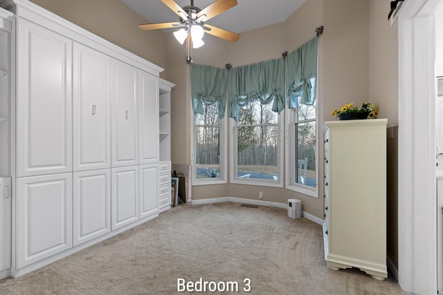 unfurnished bedroom with light colored carpet and baseboards