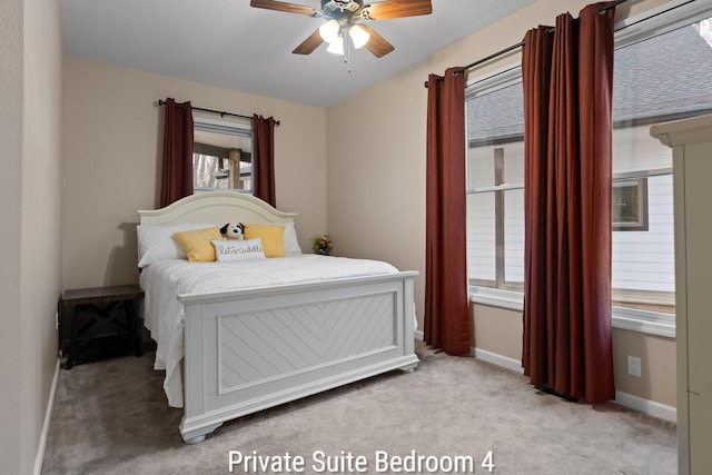 carpeted bedroom with baseboards and ceiling fan