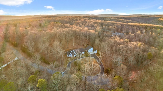 birds eye view of property with a wooded view