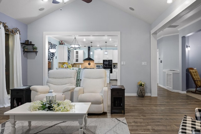 living area with baseboards, high vaulted ceiling, wood finished floors, and ceiling fan with notable chandelier