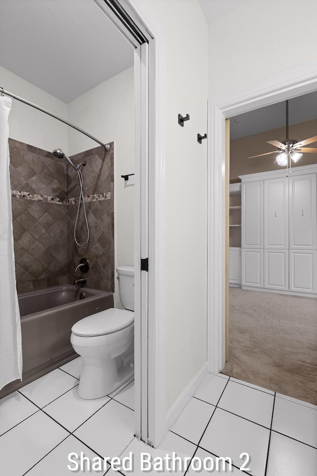 full bath with shower / bath combo, tile patterned floors, a ceiling fan, and toilet