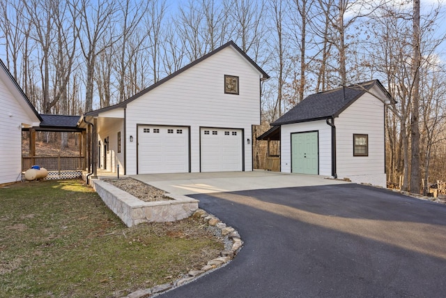 garage with aphalt driveway