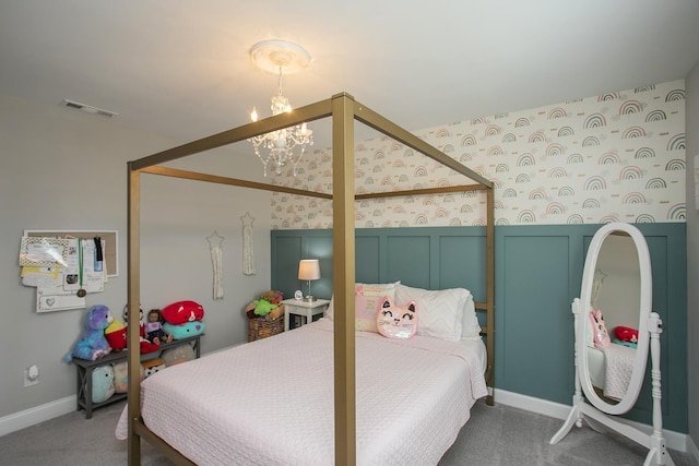 bedroom with carpet flooring, a chandelier, and visible vents